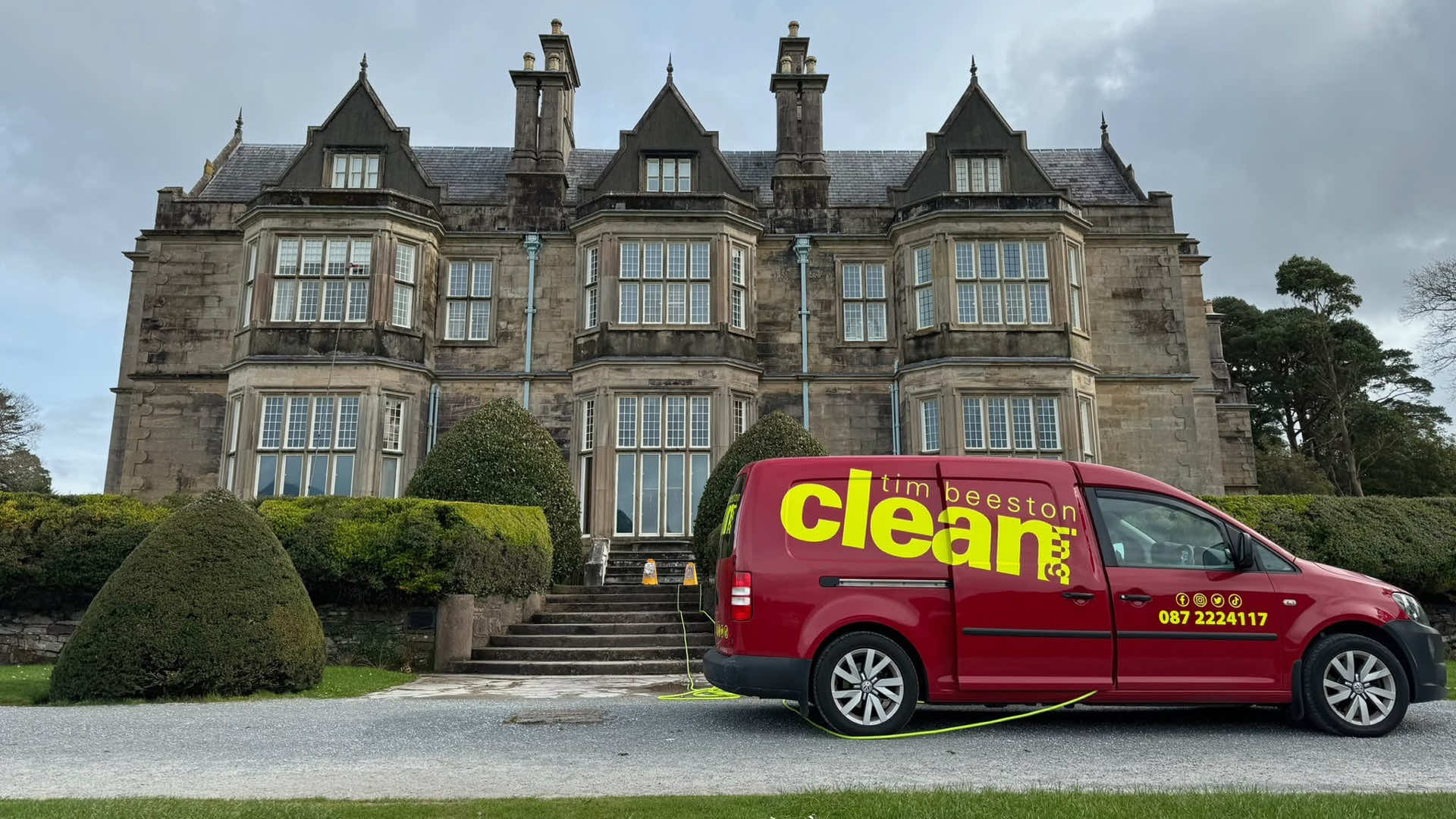 Tim Beeston Cleaning van parked in front of a large Victorian country house, with a hose run to the front steps